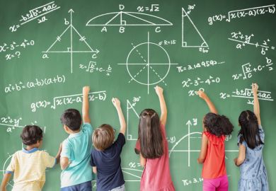 Girls and boys do mathematics on a school blackboard, symbolising gender equality