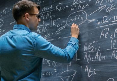 A mathematician works on the blackboard A mathematician works on the blackboard