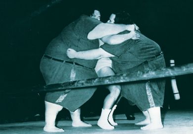 McGuire brothers squashing smaller wrestler