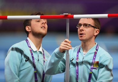 Officials measure the High Jump bar during the IAAF Athletics World Indoor Championships at Arena Birmingham, UK. To illustrate setting the bar for REF submissions.. Officials measure the High Jump bar during the IAAF Athletics World Indoor Championships at Arena Birmingham, UK. To illustrate setting the bar for REF submissions..