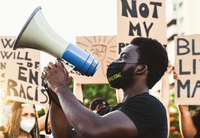Demonstrators from different cultures and race protest on street Activist movement protesting against racism and fighting for equality, Black Lives Matter - Demonstrators from different cultures and race protest on street - universities urged to take a stand on issues