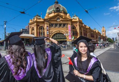 Melbourne, Australia - December 17, 2014 - RMIT university graduation day - the students walk along the Swanton St in Melbourne city for celebration day in graduation day