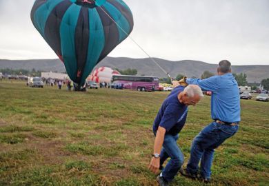 Men deflating hot air balloon, Great Prosser Balloon Rally Men deflating hot air balloon, Great Prosser Balloon Rally