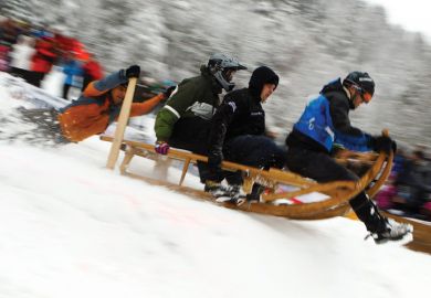 Men riding wooden sledge, Garmisch-Partenkirchen, 2012