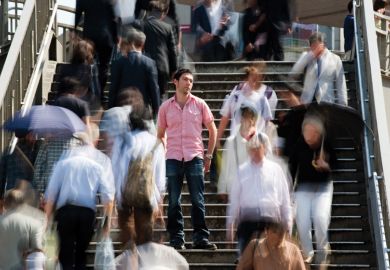 Man standing out from crowd.