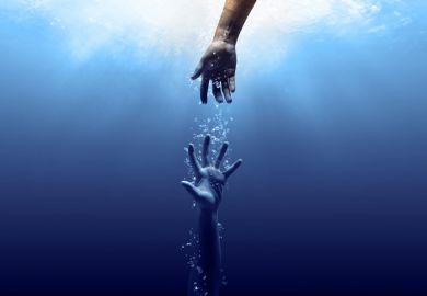 A hand reaches for another one underwater A hand reaches for another one underwater, symbolising a mental health intervention