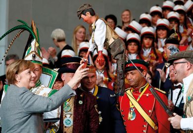 Merkel meets a puppet