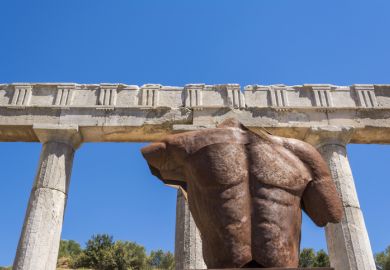 Metallic headless statue in the ancient Greek city of Messinia