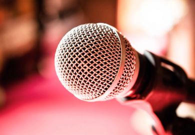 Microphone against red background (detail)