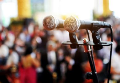 Microphones in from of an audience