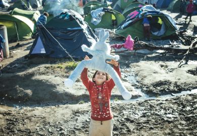 Child playing in refugee camp Child playing in refugee camp