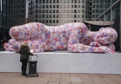 A sleeping giant sculpture made of recycled polystyrene and measuring 8 metres in length and covered in two thousands fake banknotes is installed in Canary Wharf, Docklands. To illustrate bonuses made to vice-chancellors.