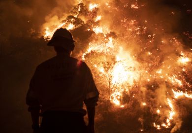 Monrovia, California  USA - September 15, 2020 Firefighters work the Bobcat Wildfire in the hills above Los Angeles.