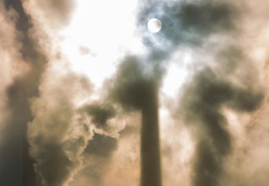 Moonlit sky behind clouds of smoke