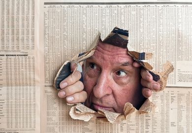 Man peeks through hole in newspaper