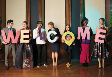 Nicola Sturgeon with WELCOME sign