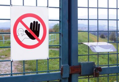 'No admission' sign on gated fence 'No admission' sign on gated fence