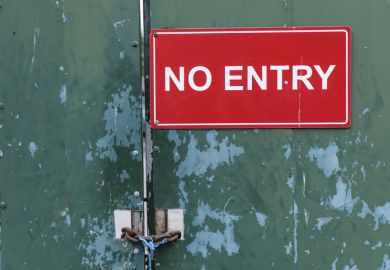 A no entry sign on a locked door A no entry sign on a locked door illustrating visa application issues, UK Home Office, academic spouse visa