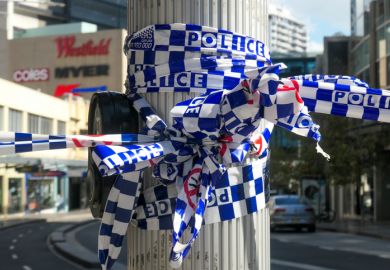 NSW Police cordon tape wrapped around a light pole. This image was taken at the corner of Oxford Street and Hollywood Avenue, Bondi Junction NSW Police cordon tape wrapped around a light pole. This image was taken at the corner of Oxford Street and Hollywood Avenue, Bondi Junction