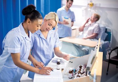 Nurses looking at chart