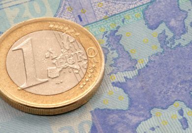 One Euro coin placed on map of Europe
