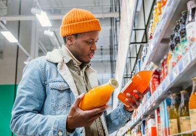 A man chooses between groceries, illustrating degree choice