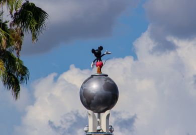 Orlando, FL, USA. August 17, 2016 Mickey Mouse statue at Hollywood Studios viewed from behind Orlando, FL, USA. August 17, 2016 Mickey Mouse statue at Hollywood Studios viewed from behind