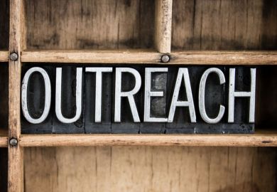 Outreach sign carved in wood