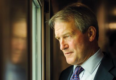 Owen Paterson looking out of window