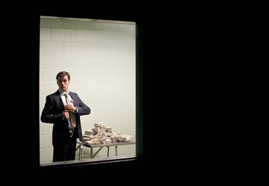 Man putting cash in his pocket behind closed door