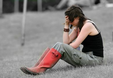 Woman with head in hand