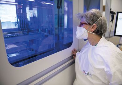 Healthcare workers work on the preparation of evaluation swabs for Coronavirus in research lab of Amedeo di Savoia hospital, Turin, Italy Healthcare workers work on the preparation of evaluation swabs for Coronavirus in research lab of Amedeo di Savoia hospital, Turin, Italy
