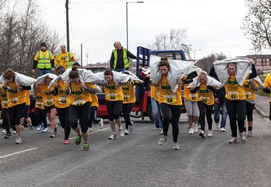 Women carrying sacks Women carrying sacks