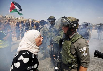 Palestinian woman argues with Israeli border policeman, West Bank Palestinian woman argues with Israeli border policeman, West Bank