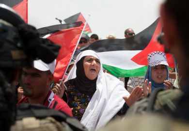 Palestinian women confront Israeli soldiers in a demonstration near Susya in the South Hebron Hills