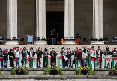 Students from UCL hold up hands painted red during a pro-Palestinian rally, 2024 Students from UCL hold up hands painted red during a pro-Palestinian rally, 2024