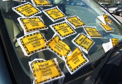 Car with bonnet covered in parking infringement stickers