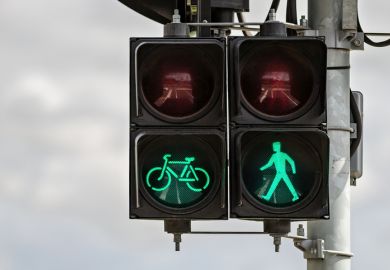 Pedestrian and cyclist traffic ‘Go’ signal representing approval of ARC grant funding
