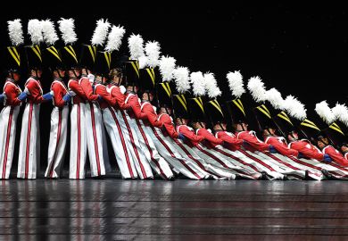 People dressed as soldiers falling like dominoes. To illustrate the "domino effect" of US colleges embracing institutional neutrality. People dressed as soldiers falling like dominoes. To illustrate the "domino effect" of US colleges embracing institutional neutrality.