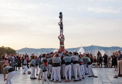 People forming human tower, Young Universities Summit 2016 People forming human tower, Young Universities Summit 2016