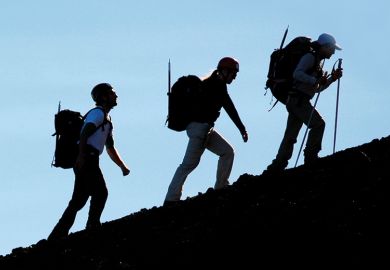 People hiking up mountain