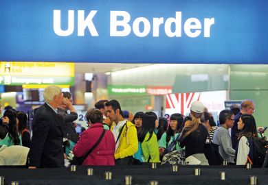 People queuing at UK border, Heathrow Airport, London