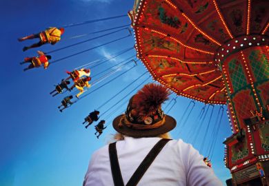 People riding on fairground ride People riding on fairground ride