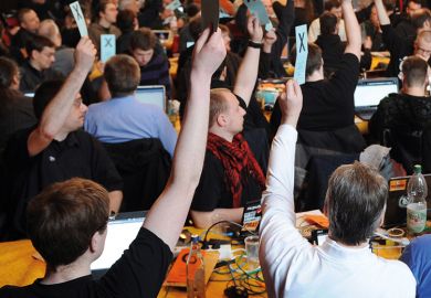 A crowd of people voting A crowd of people voting