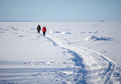 People walking through snow