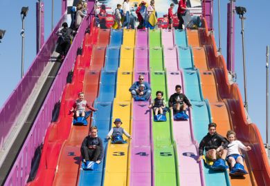 People enjoying a giant slide at the 2015 Royal Melbourne Show