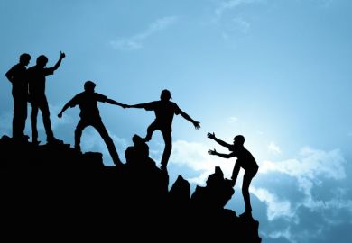 People helping each other up a hill People helping each other up a hill