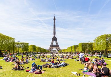 People on Champ de Mars with Eiffel Tower in background