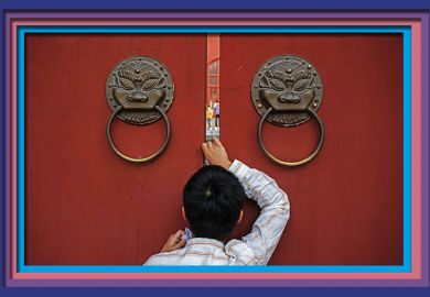 A person peeks through the large doors of the historic Drum Tower during the Golden Week holiday on October 3, 2024 in Beijing, China. To illustrate that China lags on global collaboration.