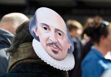 A person wearing a Shakespeare mask